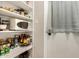 Walk-in pantry with an abundance of shelving for organized storage solutions and easy access at 4410 S Grandview Ave, Tempe, AZ 85282