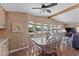 The dining area showcases large windows, blending natural light with stylish decor and wood floors at 5735 E Mcdowell Rd # 388, Mesa, AZ 85215