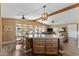 Open kitchen offers a central island, wooden cabinetry, and a seamless transition to the dining and living areas at 5735 E Mcdowell Rd # 388, Mesa, AZ 85215