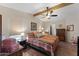 Spacious main bedroom featuring a ceiling fan, natural light, wood floors, and closet at 5735 E Mcdowell Rd # 388, Mesa, AZ 85215