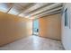 A light tan room with tile flooring and a doorway letting in natural light at 5735 E Mcdowell Rd # 388, Mesa, AZ 85215