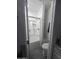 Modern bathroom featuring a shower-tub combo with glass doors and ample storage at 6010 W Coolidge St, Phoenix, AZ 85033