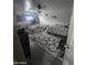 The bedroom has a seating area, full size bed, and tile floors at 6010 W Coolidge St, Phoenix, AZ 85033
