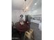 Functional kitchen with white cabinets, tiled flooring, and a dining table at 6010 W Coolidge St, Phoenix, AZ 85033