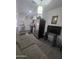 Open-concept living room with a seamless transition into the kitchen area at 6010 W Coolidge St, Phoenix, AZ 85033