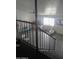 View from the top of the staircase of the living area below at 6010 W Coolidge St, Phoenix, AZ 85033