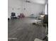 Spacious living room featuring neutral walls, ceiling fan, and tile floors at 6010 W Coolidge St, Phoenix, AZ 85033