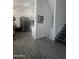 Open-concept space leading to a staircase with modern tile floors at 6010 W Coolidge St, Phoenix, AZ 85033