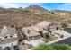 Aerial view of home with desert landscaping, solar panels and close proximity to neighbors at 6326 W Misty Willow Ln, Glendale, AZ 85310