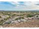 Expansive aerial view of a residential community, showcasing mountain views and neatly landscaped properties at 6326 W Misty Willow Ln, Glendale, AZ 85310