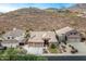 Aerial view of home with desert landscaping, desert mountain views and close proximity to neighbors at 6326 W Misty Willow Ln, Glendale, AZ 85310