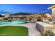 Backyard oasis with a sparkling pool, built-in grill, and lounge chairs overlooking manicured landscaping at 6326 W Misty Willow Ln, Glendale, AZ 85310