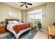 Cozy bedroom with natural light, a comfortable bed, and views of the surrounding area at 6326 W Misty Willow Ln, Glendale, AZ 85310