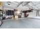 Spacious, well-organized garage featuring epoxy flooring, ample storage, and organizational systems at 6326 W Misty Willow Ln, Glendale, AZ 85310