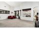 Bright living room with large windows, plush seating, and views of the outdoor pool and grill at 6326 W Misty Willow Ln, Glendale, AZ 85310
