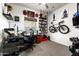 Well-lit home office featuring modern desk, white board, dark carpet, and athletic-themed decor at 6326 W Misty Willow Ln, Glendale, AZ 85310