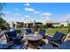 Expansive backyard with a pool, fire pit, covered patio, lush landscaping, and a serene ambiance at 7002 E Aster Dr, Scottsdale, AZ 85254