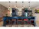 Stylish bar includes custom cabinets, granite countertops, wine storage, and pendant lights for a luxurious feel at 7002 E Aster Dr, Scottsdale, AZ 85254