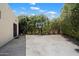 Spacious backyard basketball court with mature trees offers a private outdoor recreation area at 7002 E Aster Dr, Scottsdale, AZ 85254
