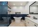 Modern bathroom showcasing a standalone tub, walk-in shower, and elegant tile work for a spa-like experience at 7002 E Aster Dr, Scottsdale, AZ 85254