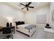 Bedroom featuring a white bed, desk, and light-colored carpet at 7002 E Aster Dr, Scottsdale, AZ 85254