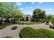 Well-manicured front yard with desert landscaping enhances the home's curb appeal at 7002 E Aster Dr, Scottsdale, AZ 85254