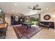 Recreation room featuring a pool table, bar area, comfortable seating, and natural light at 7002 E Aster Dr, Scottsdale, AZ 85254