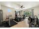 Home gym featuring a variety of workout equipment and outdoor access at 7002 E Aster Dr, Scottsdale, AZ 85254