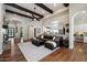 Inviting living room with exposed beams, hardwood floors, and an open layout ideal for entertaining at 7002 E Aster Dr, Scottsdale, AZ 85254