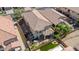 Aerial view of a private backyard with patio, well-maintained garden, and a manicured lawn at 7252 E Nance St, Mesa, AZ 85207