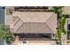 Overhead shot shows tile roof, private patio, and manicured lawn of house in a desert community at 7252 E Nance St, Mesa, AZ 85207