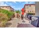 Outdoor area has grill, palm trees, garden, and rocks at 7252 E Nance St, Mesa, AZ 85207