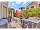 Backyard with paver patio, grill, dining set, and palm tree at 7252 E Nance St, Mesa, AZ 85207