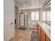 Bright bathroom with a separate shower and tub, dual sinks, and shuttered windows at 7252 E Nance St, Mesa, AZ 85207
