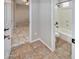 Bathroom includes tiled shower and floors plus a toilet and window at 7252 E Nance St, Mesa, AZ 85207