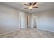 Bedroom with tile flooring and multiple doorways at 7252 E Nance St, Mesa, AZ 85207