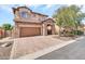 Charming two-story home with brick driveway, stone accents, and a well-maintained front yard at 7252 E Nance St, Mesa, AZ 85207