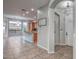 Bright and airy home foyer with tiled floors leading to an open-concept kitchen and dining area at 7252 E Nance St, Mesa, AZ 85207