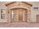 Inviting front entrance with brick accents and well-maintained landscaping for enhanced curb appeal at 7252 E Nance St, Mesa, AZ 85207