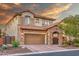 Beautiful two-story home featuring stone accents, a tile roof, and a spacious two-car garage at 7252 E Nance St, Mesa, AZ 85207