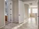 Hallway features tile flooring and access to a bathroom at 7252 E Nance St, Mesa, AZ 85207