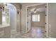 Hallway features tile flooring and access to multiple bedrooms at 7252 E Nance St, Mesa, AZ 85207