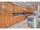 Gourmet kitchen with granite countertops, stainless steel appliances, and abundant cabinet storage at 7252 E Nance St, Mesa, AZ 85207