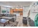Bright living room with tile floors, open kitchen, and staircase leading to the upper level at 7252 E Nance St, Mesa, AZ 85207