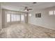 Spacious main bedroom with tiled floors, plantation shutters, and plenty of natural light at 7252 E Nance St, Mesa, AZ 85207