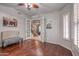 Inviting office with hardwood floors, gray walls, and a doorway view of the staircase and living room at 7252 E Nance St, Mesa, AZ 85207