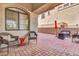 Relaxing outdoor patio with comfortable seating, brick flooring, and a cozy ambiance at 7252 E Nance St, Mesa, AZ 85207