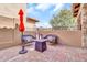 Outdoor patio featuring brick flooring, wrought iron fencing, outdoor furniture, and a relaxing ambiance at 7252 E Nance St, Mesa, AZ 85207