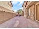 Paver patio has grilling area and red umbrella offering shade for outdoor living at 7252 E Nance St, Mesa, AZ 85207