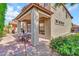 Covered patio provides shade for outdoor entertaining and dining with access to home at 7252 E Nance St, Mesa, AZ 85207